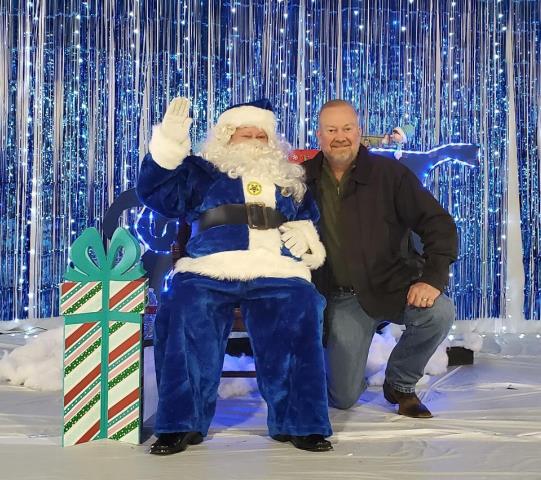 Photo of Sheriff Rand Henderson and Santa Clause wearing his blue suit to support law enforcement. 